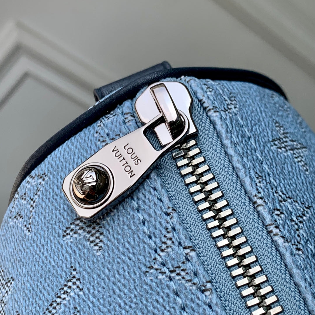 Louis Vuitton Keepall Bandoulière 25 Insky Blue Monogram Heritage Canvas Dark Blue Calfskin Bag